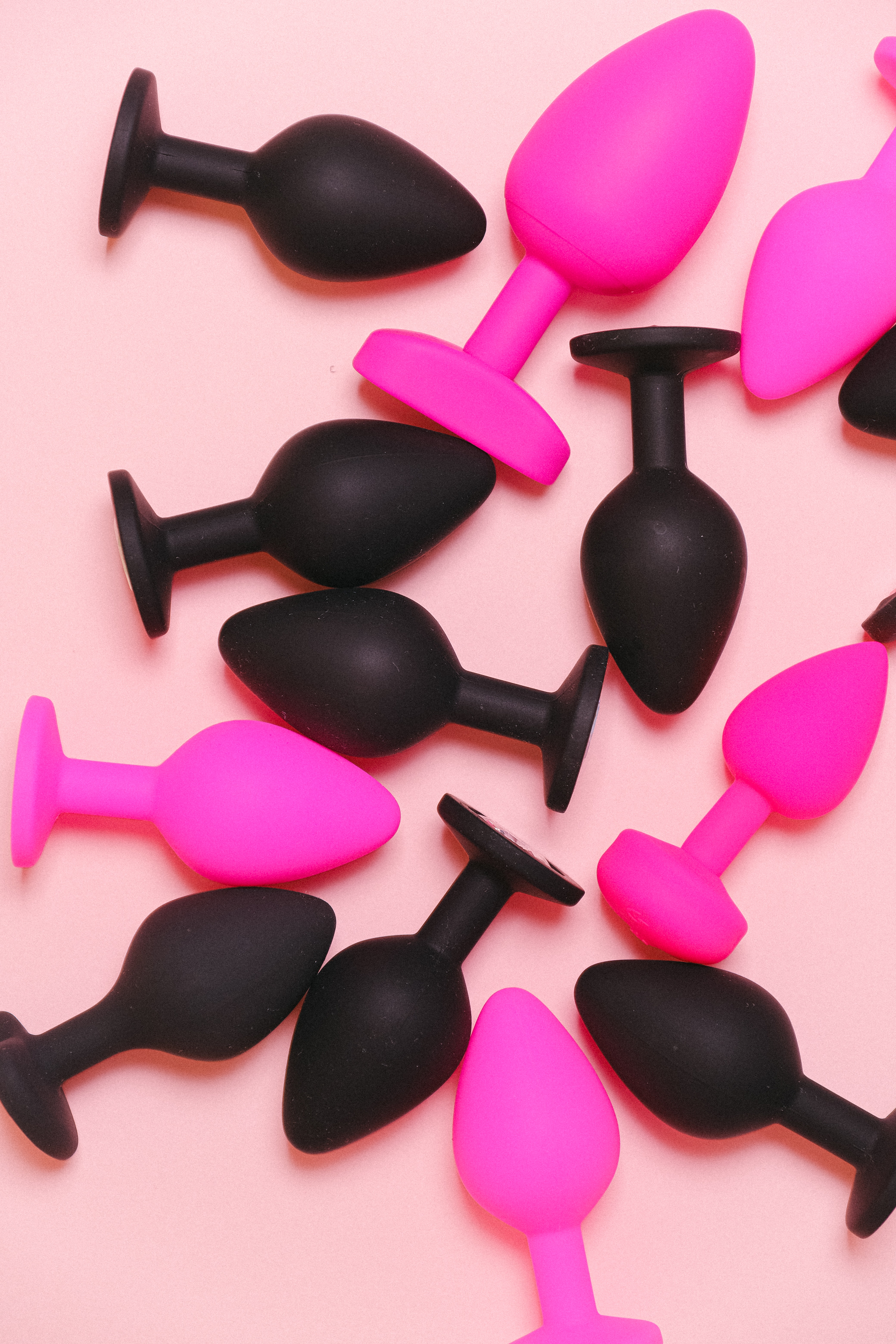 Black and pink colored butt plugs.