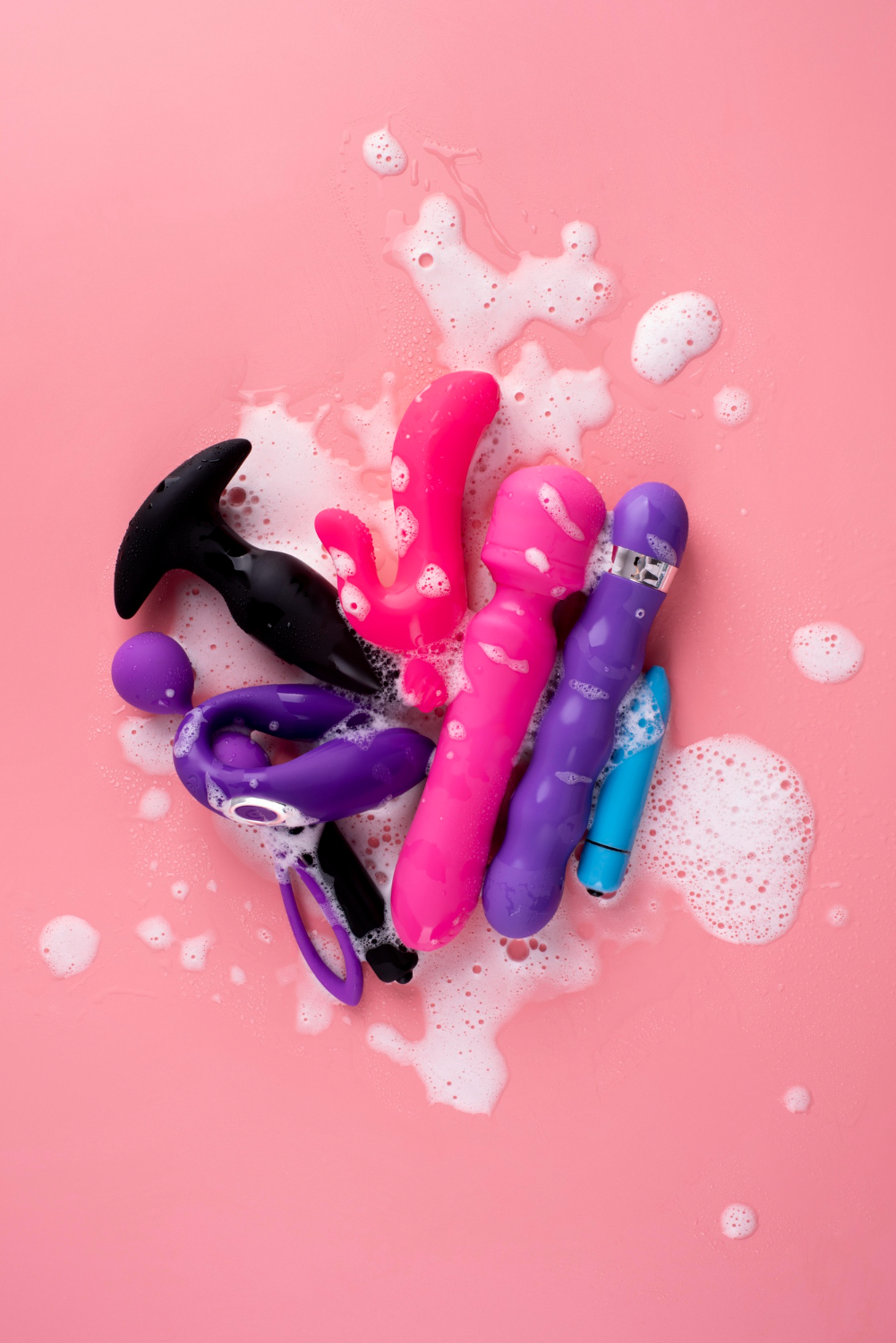 Close up image of cleaning sex toys.